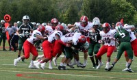 Crusaders defensive end Robinson De La Cruz (#99 center) smothers Mansfield quarterback, as Stepinac’s defense held the Green Hornets to seven points, while the Crusaders offense scored seven touchdowns in a 42-7, win over Mansfield. 