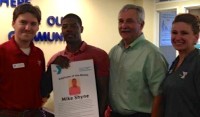 (L to r) Zach Swierat, YMCA Membership Director, Mike Shyne, Membership Representative and Residence Assistant, Executive Director Tom Hay, and White Plains YMCA Employee of the Month, Heather Pellegrino.