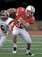 Lucas Beni | The Examiner News Fox Lane's Lucas Beni picks up yardage in Saturday's Homecoming game vs. Mamaroneck.