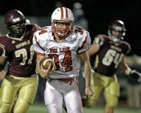 Fox Lane running back Lucas Beni picks up some big yardage during last Friday's game at Arlington.