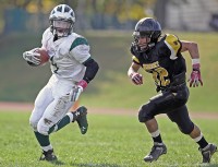 Jack Minerva | The Examiner News Pleasantville's Jack Minerva runs with the football in Saturday's Class B semifinal game at Nanuet.
