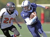 Lou Fillipelli | The Examiner News Byram Hills quarterback Lou Filippelli runs with the football in Sunday's game vs. Rye.