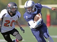 Byram Hills quarterback Lou Filippelli runs with the football in Sunday's game vs. Rye.