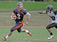 Cameron Ciero | The Examiner News Greeley quarterback Cameron Ciero carries the ball in last Thursday's game against Yorktown.