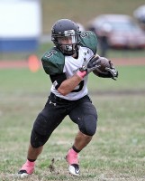 Yorktown's Nick Santavicca chugs for some of his 328 rushing yards in 32-21 win over Greeley.