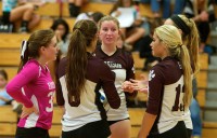 harrison volleyball | The Examiner News Harrison players strategize during a timeout at Byram Hills last week.
