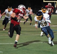 Somers FB Timmy Fazzinga is chased after big gain before being dropped by Panas DB Nick Miynar in 45-0 Tusker win.