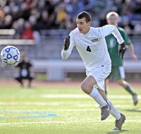 Matt Berger of Byram Hills chases after the ball in Saturday's 2-1 Bobcat victory over Vestal in the regional final.