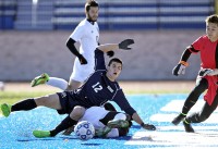 Brandon Drossman | The Examiner News The Bobcats' Brandon Drossman is sent to the turf by a sliding tackle late in Saturday's state semifinal playoff game vs. Greece Athena.