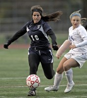 The Bears' Jenna Heitzler moves the ball past Lucy Kohlhoff of Bronxville in the Class B title game.