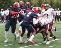Crusaders-4 | The Examiner News Stepinac’s Demarcus Miller (#3 center) tackles Lions running back Steven Viegas. Miller leads the Crusaders in tackles with 27, while his defense has only relinquished 83 points to opponents in nine games this season.
