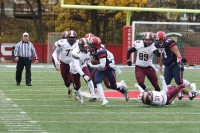 Crusaders running back Malcolm Major breaks through a hole his offensive line made for him and runs 52 yards for a touchdown. 