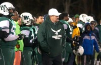 Coach Mike Meade and a dejected Falcons bench watch the final moments of Saturday's loss to Millbrook. 