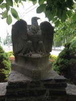 The eagle that once sat atop the monument has been placed behind the roll of honor plaque on a wall.