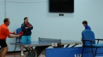 USA Table Tennis CEO Gordon Kaye, left, tries his hand at a game with a Westchester Table Tennis Center member in Pleasantville as former U.S. Olympian Sean O'Neill looks on.