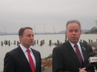 The county executives of Westchester and Rockland urged Gov. Andrew Cuomo on Monday to set aside nearly 40 percent of state settlement funds from two banks for construction costs associated with the new Tappan Zee Bridge. Using the construction site of the new span as a backdrop, Westchester County Executive Rob Astorino and Rockland County Executive Ed Day said that  alt=