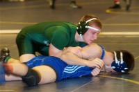 Dan Kraemer | The Examiner News Harrison senior and team captain Daniel Kraemer (top) and the Huskies look for another good season on the mats.