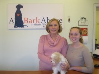 Christine Sinclair and her daughter, Avery, opened the A Bark Above day care center for dogs in Somers last year. Also shown above is their newest dog, Charlotte. Photo credit: Neal Rentz 
