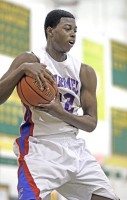 Josh Alexander | The Examiner News Carmel's Josh Alexander hauls in rebound in the Rams' 47-42 loss to Greeley last Thursday in the first round of the Lakeland tournament.