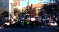 With the help of White Plains Police, demonstrators march down Martine Avenue to POlicce Headquarters.