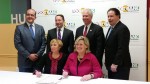 Jeanne Blum, seated left, executive director for the Westchester Coalition for the Hungry and Homeless, and Food Bank for Westchester Executive Director Ellen Lynch sign merger agreement between the two organizations. 