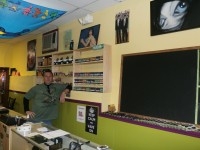 Eric Peterson stands inside his store on Main Street in Brewster called Kine Buddies. Peterson hopes the shop is way to attract young people to downtown. DAVID PROPPER PHOTO 