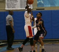 Stepinac sophomore Jorden Means (right) is future star for the Crusaders. Means displays his defensive skills against Marshall Academy of the PSAL AA, at the Big Apple Basketball Invitational, at Baruch College on Saturday. 