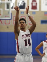 Yes, that is former White Plains High School player Jordan Tucker draped in a Crusaders red, white and blue uniform. The sophomore phenom transferred to Stepinac High School in September and is making an impact on the Crusaders basketball team. 
