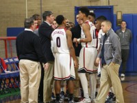 Second-year Stepinac Head Basketball Coach Steve Herman speaks to his team, as he tries to rally his squad against Cardinal Hayes. Nonetheless, the Crusaders lost their fourth straight game, while losing to the Cardinals, 85-70. 