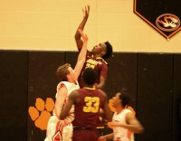 Mt. Vernon’s guard Marco Morency leaps to get a shot off despite the defensive efforts of Tigers forward Kevin Trapp. Morency had 18 points and 12 rebounds for the Knights, as they beat the Tigers, 58-45, on January 21. 
