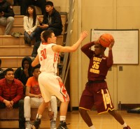 Tigers junior guard Taylor Nussbaum (left) has proved this season that he can be a defensive presence, as he defends Knights Jamie Wilshire (right). 