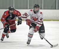 Fox Lane's Matthew Leader controls the puck. 