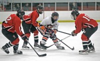 Greeley's Scott Jakubowicz tries to maneuver past a  trio of Masuk defenders.  