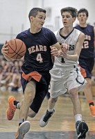 Briarcliff's Jackson Wexler drives on Pleasantville's Mike Manley.   