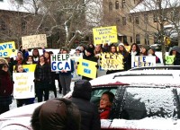 At a recent rally, GCA students approach Sr. Carol Wagner as she drives off the campus.