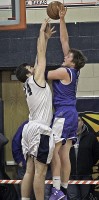 Hen Hud senior F Carson Jacobs is met by Bobcat big man Andrew Groll in Sailors' quarterfinal playoff loss to Byram Hills.