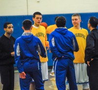 Mahopac and Carmel captains meet with officials before their ballyhooed game on January 23rd, which went off without a hint of bad blood or unsportsmanlike behavior. 