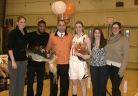 White Plains High School Girls Basketball recorded their best record, 10-7, in three years. [L-r] Head Coach Tara Flaherty, Assistant Coach Spencer Smith, Antonio Lacarbonara, the father of senior center Isabella “Izzy” Lacarbonara, Isabella’s mother Lisa and Assistant Coach Amy Ferraro celebrated Senior Day, on Friday, Feb. 5, before the Tigers beat Mamaroneck High School, 56-33. Isabella’s grandfather is Nick Perriello, proprietor of Nicky’s Pizza, which will be reopening on Mamaroneck Avenue in the next two weeks. Perriello and his son Jake also attended the game. Albert Coqueran Photos 