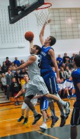 Putnam Valley's Mike DelGuidice is hunted by Haldane's Edmund Fitzgerald in Blue Devils' 49-43 league-title-clinching win.