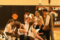 Lady Tigers Head Coach Tara Flaherty (center) tries to find solutions in the fourth quarter to a lack of scoring by her team. The Tigers scored only five points in the fourth quarter and were defeated by Ursuline, 50-38, at WPHS, on Jan. 30. Albert Coqueran Photo