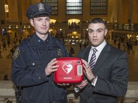 Frances Rush IV stands with the MTA officer, Michael Burns, who together rescued the life of a 70-year-old man at Grand Central Station. COURTESY OF THE MTA  