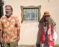 Dan Stoddard and Milagros Lecuona in Cuba. The sign reads in Spanish that “In this house lived Ernesto Lecuona Y Casado.”