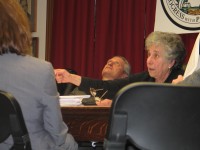 Yorktown Supervisor Michael Grace can’t bear to watch as Councilman Susan Siegel asks questions about plans to relocate the town’s highway department. 