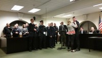 New Pleasantville Police Officer Kevin Murphy is welcomed to the village by officials and department brass last week.