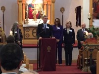 White Plains Mayor Tom Roach addresses attendees at St. Gregory the Enlightener Armenian Church 100-Year Remembrance of the Armenian Genocide. Roach is accompanied by Councilwoman Milagros Lecuona (left) and Councilmembers Nadine Hunt-Robinson, Beth Smayda and Dennis Krolian (right).