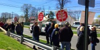 About 200 White Plains residents from neighborhoods in the south end of the city rallied in front of WPHS across from the proposed entrance to the FASNY K-12 campus.