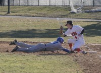 Gerigh Hauser was brought up to the varsity as a sophomore to play first- base for the Tigers. Hauser (right) almost got the tag down on Mahopac leadoff hitter C.J. Sager (left) for a pick-off but Sager got back safely. 