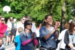 Stayin' Alive 5K organizers Michele Berliner, left, and Christy Saltstein cheer on last year's runners during inaugural event to raise money for police and fire departments and ambulance corps. The race will be run again this Saturday at Windmill Farm in Armonk.