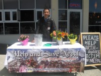 Gyaljen Nuru Sherpa collecting funds and goods outside Jewel of Himalaya restaurant in Yorktown. 