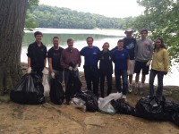 John Halloran, center, organizer of the Restore Byram Lake Reservoir Watershed clean up on Saturday, is surrounded by several of the volunteers.